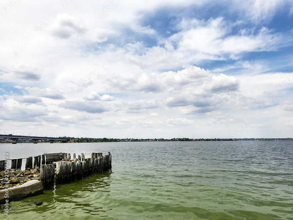 The river bank and sky with clouds. The river bank and sky with clouds.
