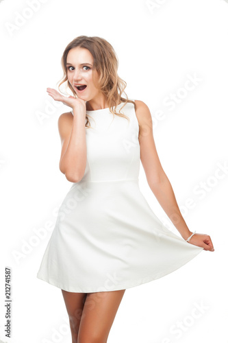 Joyful girl in white dress on white background.
