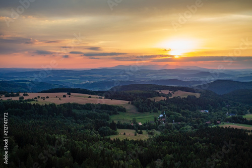 Summer sunset landscape green forest and mountains