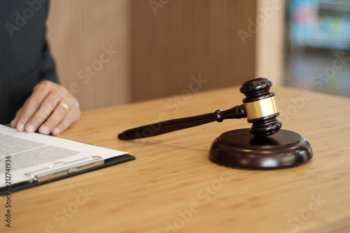 Judge gavel hammer on Lawyer desk.