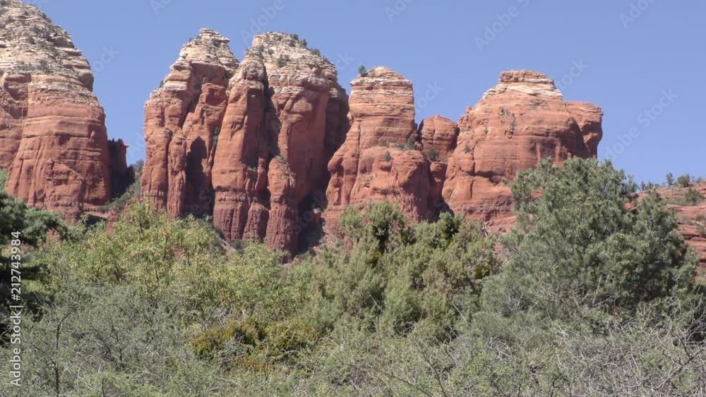 Arizona, Sedona, A close up of Coffeepot Rock with trees in the front of it Arizona, Sedona, A close up of Coffeepot Rock with trees in the front of it