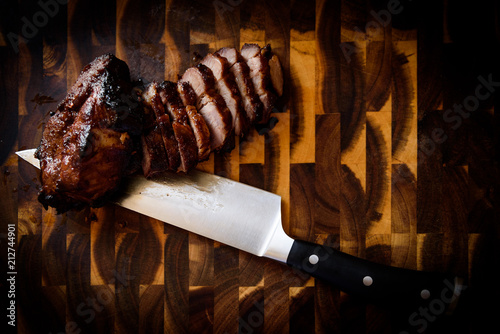 Sliced Char Siu with Knife on Butcher's Block