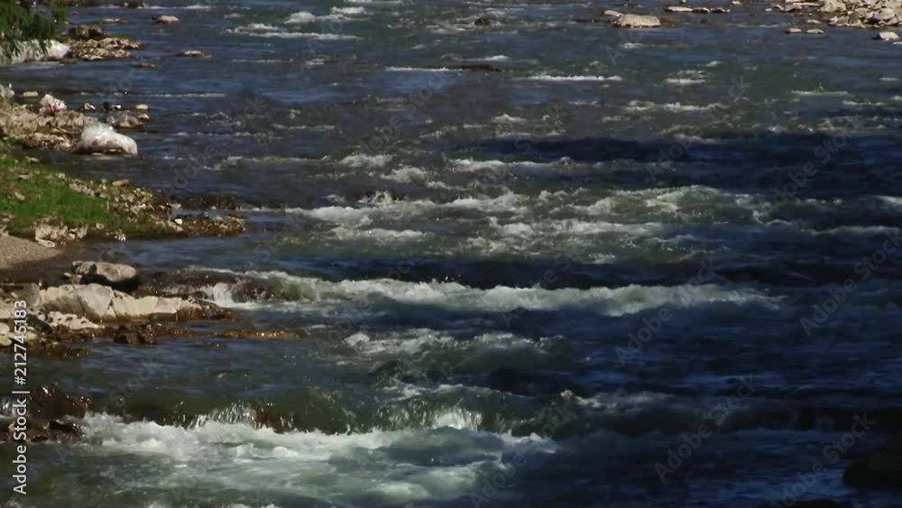 Spring river flowing between the rocks Spring river flowing between the rocks
