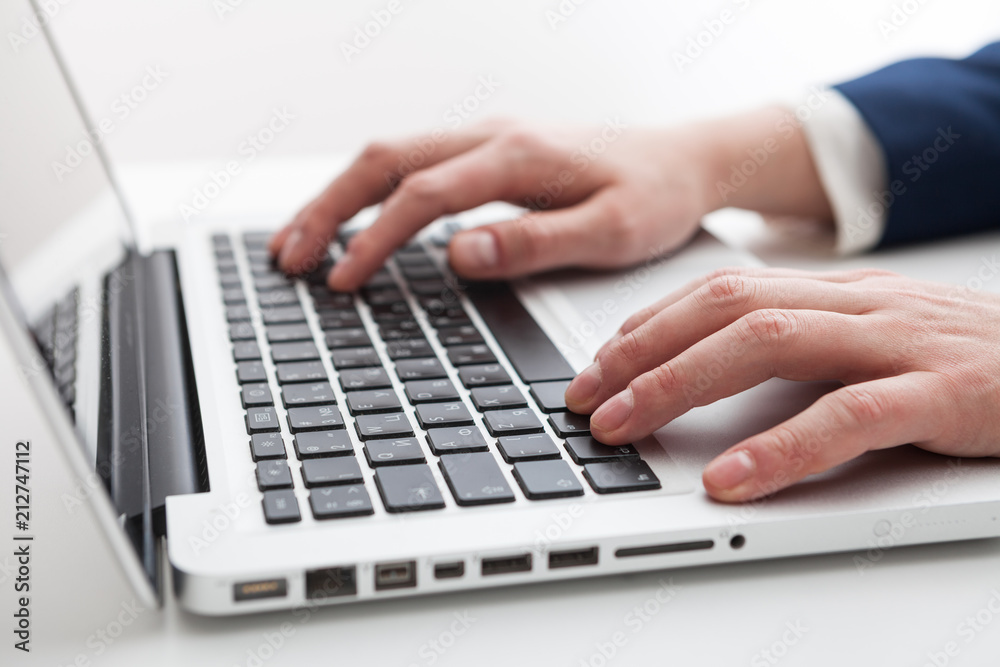 Close Up of businessman hands using laptop computer Close Up of businessman hands using laptop computer