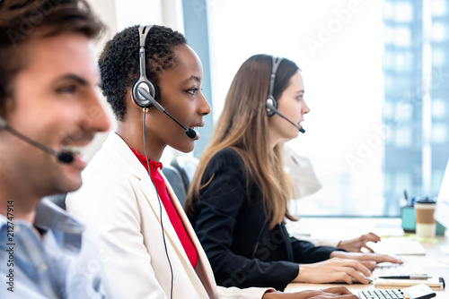 Diverse call center team working in office