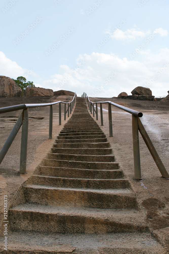 Gateway and rock cut steps leading to the Jain temple complex, Chandragiri Hill, Shravanbelgola, Karnataka Gateway and rock cut steps leading to the Jain temple complex, Chandragiri Hill, Shravanbelgola, Karnataka