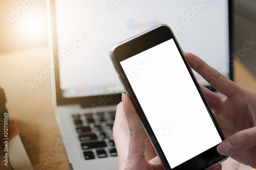 Close up of woman using mobile smart phone,sending massages on the garden.having sunbath.Phone with black screen,texting,video calls,