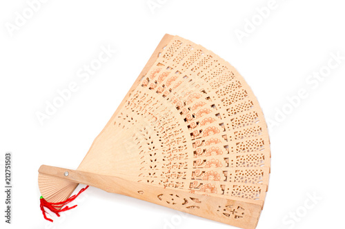 Wooden carve folding  chinese style hand fan on white background. photo