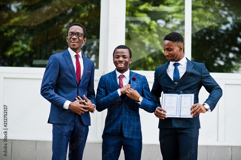 Three african american happy successful mans at suit with diploma at graduation day. Three african american happy successful mans at suit with diploma at graduation day.