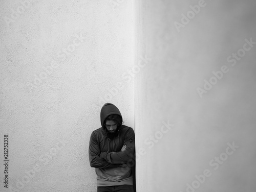 Fotografie Man standing in a corner alone