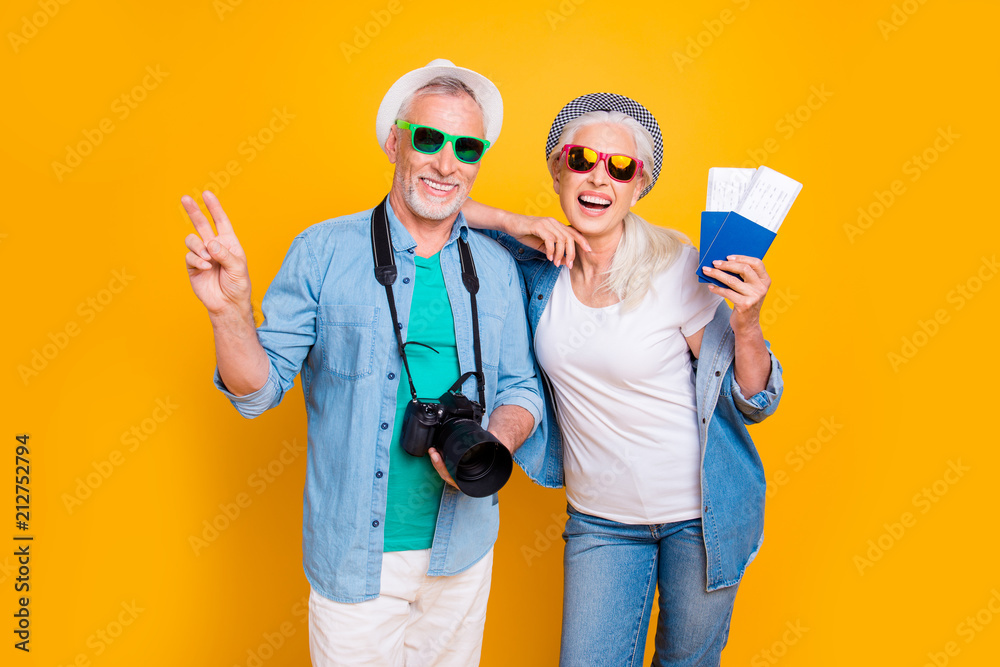 Tourism tourists traveler journey rest weekend vacation holiday relax concept. Photo portrait of excited guy two fingers digicam  lady vip passengers showing document with tickets isolated background