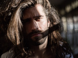 Young man with long hair portrait
