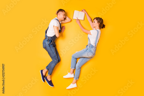 Story telling interesting discussing college concept. Above full length size high-angel legs photo of clever smart excited joyful guys chilling out resting relaxing isolated bright vivid background