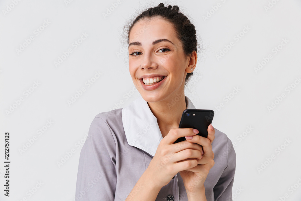 Portrait of a smiling young housemaid Portrait of a smiling young housemaid