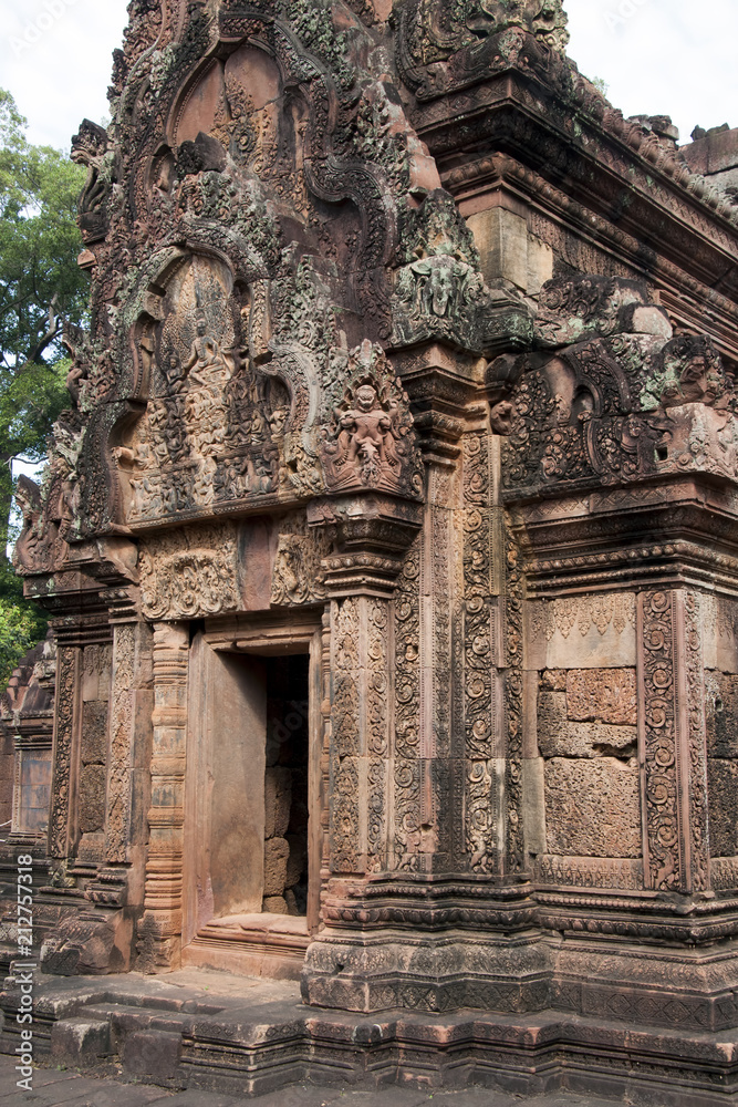 Angkor Cambodia, west facing door and pediment with Siva seated on the summit of Mount Kailasa  on southern library at the 10th century Banteay Srei temple