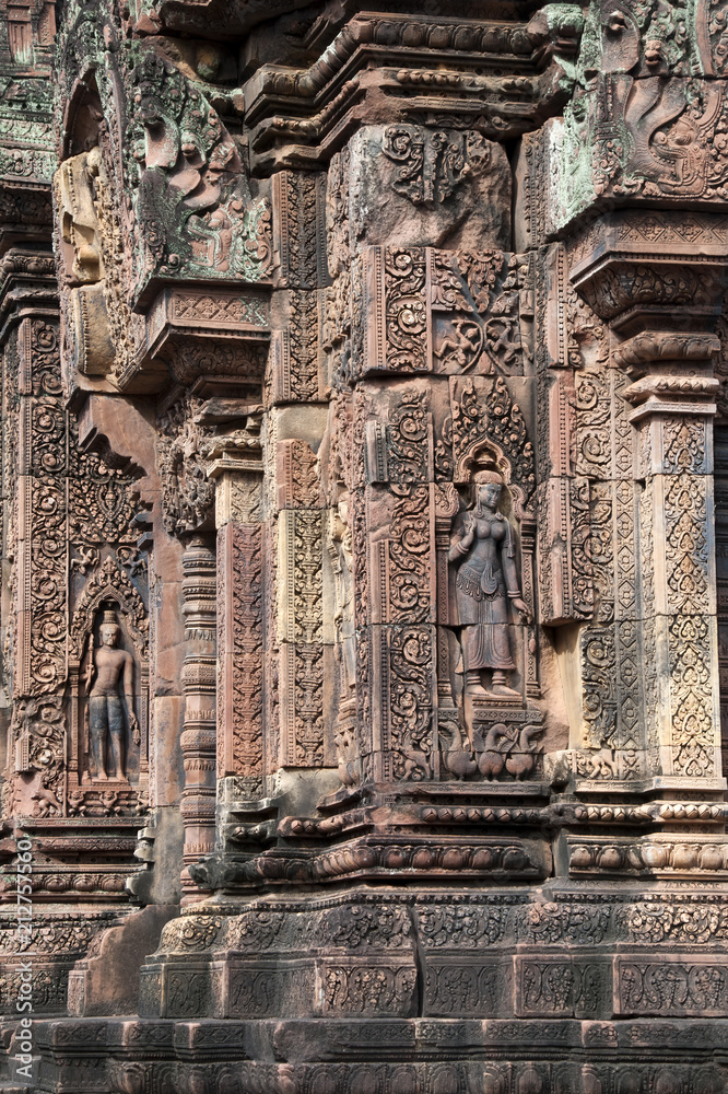 Angkor Cambodia, ornate carvings with apsaras on walls at the 10th century Banteay Srei temple