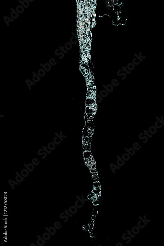 water jet with spray on a black background