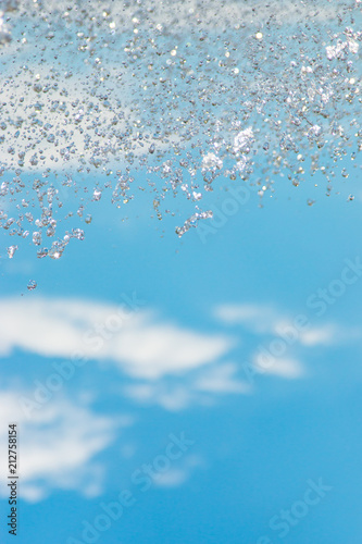 water jet with spray on the sky background