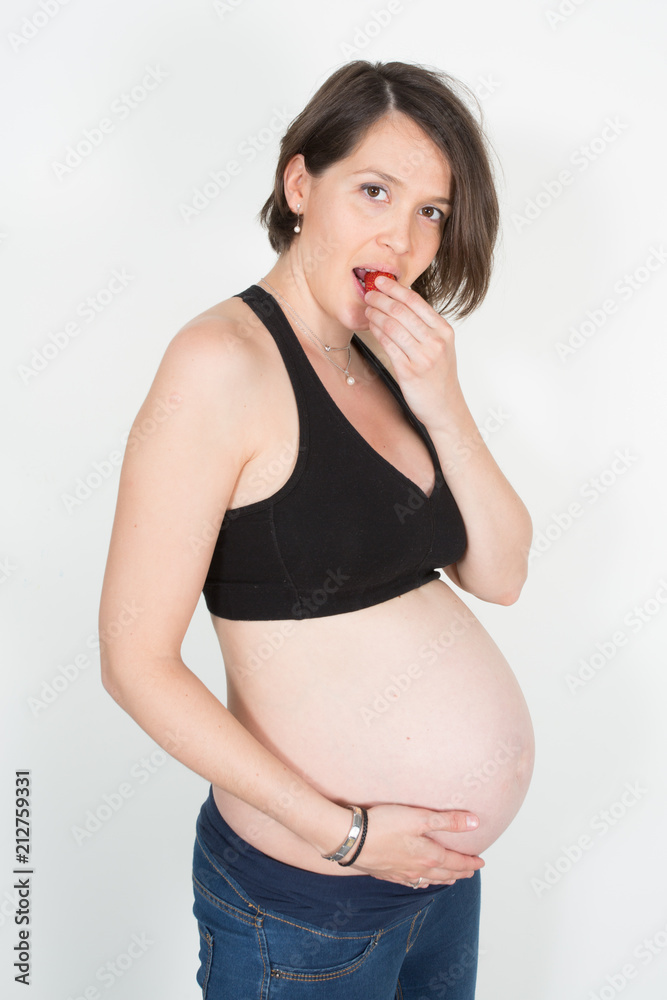 pregnant woman has a big desire for strawberries pregnant woman has a big desire for strawberries