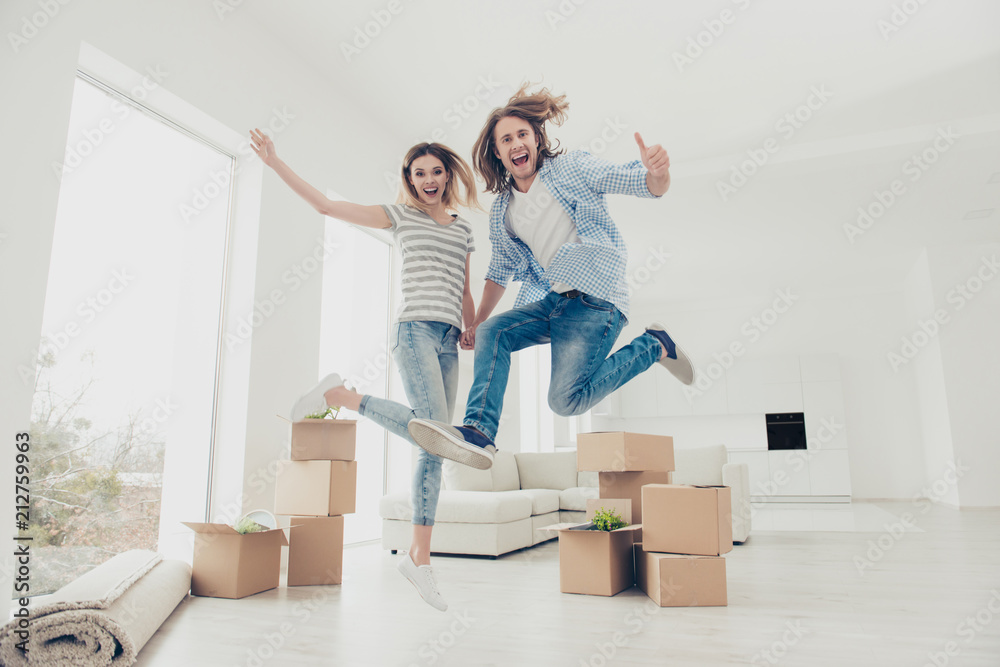 Yes yeah hooray wow! Change improvement success good mood day emotion expressing ownership concept. Full length size photo portrait of joyful cheerful partners jumping up holding hands - obrazy, fototapety, plakaty 