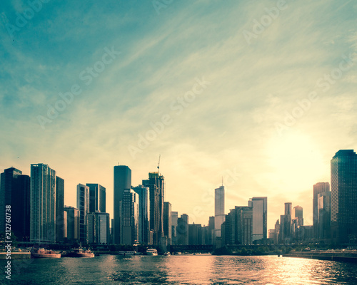 Downtown Chicago skyline at sunset with buildings and Lake Michigan © littleny