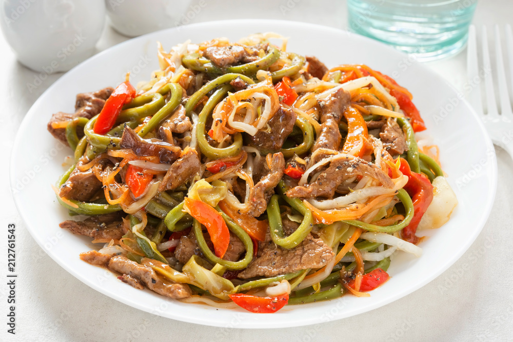 Chilli beef noodles. Wok fried beef in tamarind & soy sauce with green noodles, bean sprouts, carrots and red peppers Chilli beef noodles. Wok fried beef in tamarind & soy sauce with green noodles, bean sprouts, carrots and red peppers