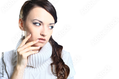 Pensive beautiful girl in sweater with copy space for text