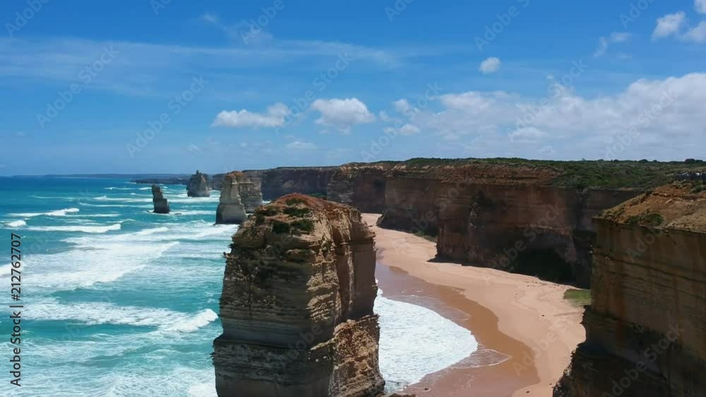 Stunning aerial drone view of the Twelve Apostles, a collection of limestone stacks & tourist attraction off the shore of Port Campbell National Park, by the Great Ocean Road in Victoria, Australia.