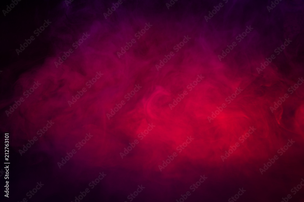 Colored purple and red smoke on a black background closeup
