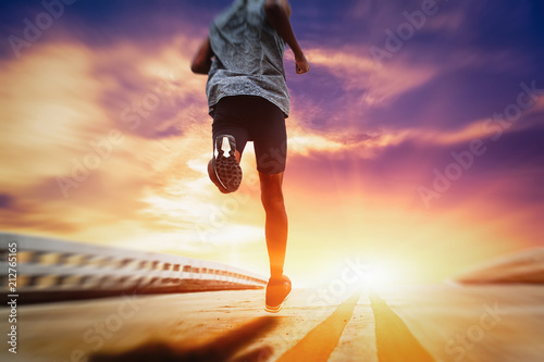 Fototapeta Athletes are running on the street with morning sunshine.
