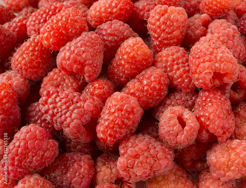 Background of raspberries. Fresh raspberries closeup. Top view. Background of red berries. 