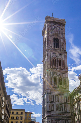 Giotto's Campanile - Bell tower of Florence Duomo Cathedral (Cattedrale Santa Maria del Fiore) on bright day with sunshine of warm sun, Florence, Tuscany, Italy photo