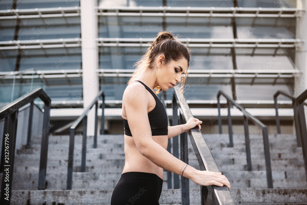 Fototapeta premium Sport woman. Rest.Drink water. Water bottle .Motivation. Sport concept