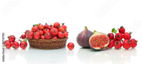 figs, apples and hawthorn berries on a white background