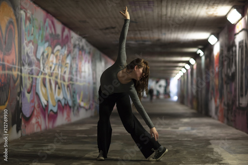 Female Dancer in Motion Dancing in an Urban Underpass