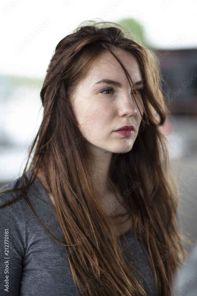 Side view portrait of young woman with brown hair Side view portrait of young woman with brown hair