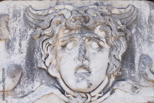 Partly ruined Head of Medusa in the temple of Apollo, Didim, Turkey