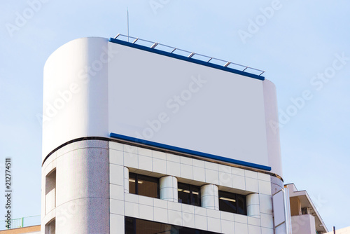 Wallpaper Mural White banner on the facade of the building, Tokyo, Japan. Frame for text. Torontodigital.ca