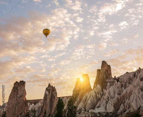 Interesting rocky terrain and airy multicolored ball in the air. Turkey. Cappadocia. Goreme National Park. 