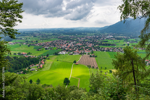 View on Grassau. Grassau is a market town in the district of Traunstein in Bavaria in Germany. It is located south of lake Chiemsee in the valley of the Tiroler Ache.