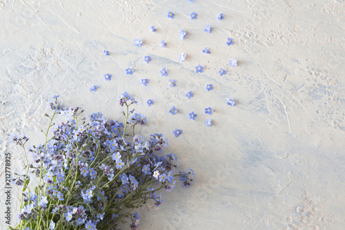bouquet of flowers forget me nots on a light table