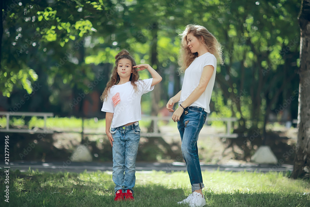 mom and daughter happy together / family happiness cheerful mom with daughter smiling mom and daughter happy together / family happiness cheerful mom with daughter smiling