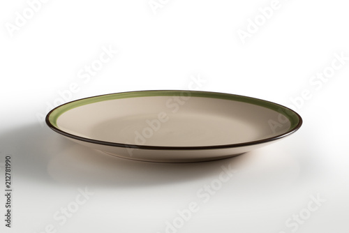 Beige round plate with green and brown border