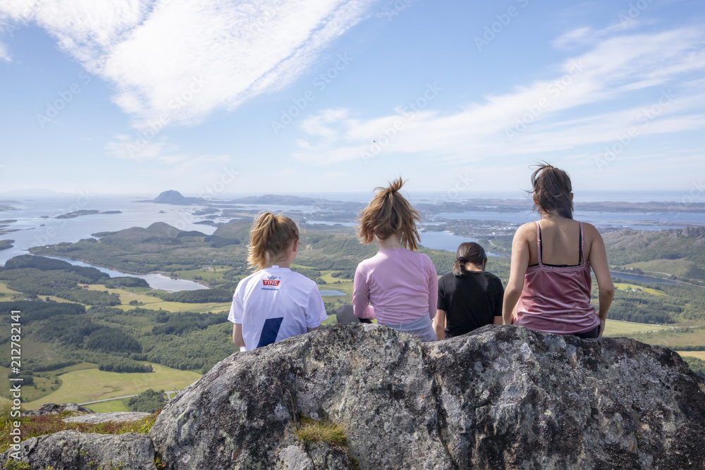 Happy hiking girls on Ramntind mountain  in Nordland county Northern Norway