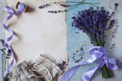 Fototapeta Naklejka Na Ścianę i Meble -  Background with lavender flowers, sachet bags and paper for text