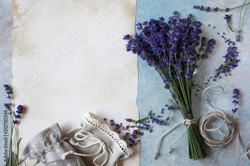 Fototapeta Naklejka Na Ścianę i Meble -  Background with lavender flowers, sachet bags and paper for text