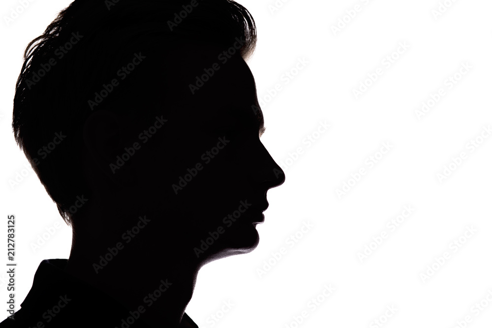 silhouette of an unrecognizable guy, man face profile on a white isolated background
