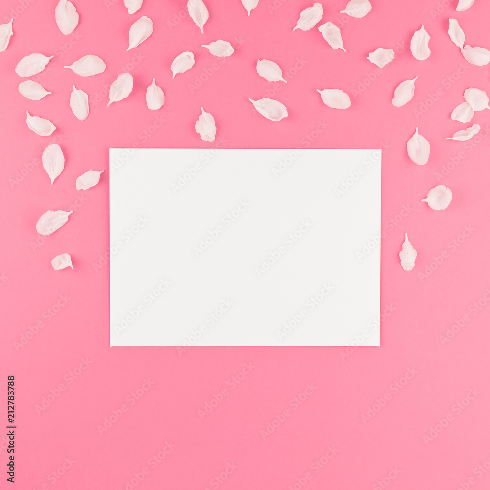 Flat lay of white postcard mock up with petals