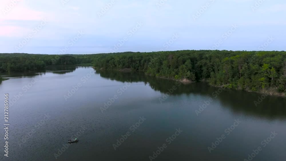 4K Arial View of a Man Made Lake and forestry around the body of water. 4K Arial View of a Man Made Lake and forestry around the body of water.