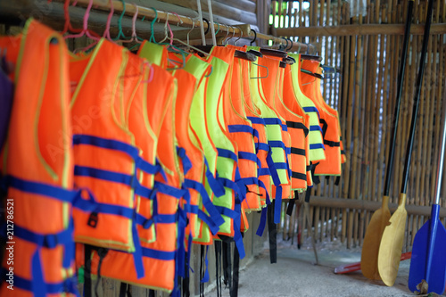 row of  life jacket hanging for tourist services.